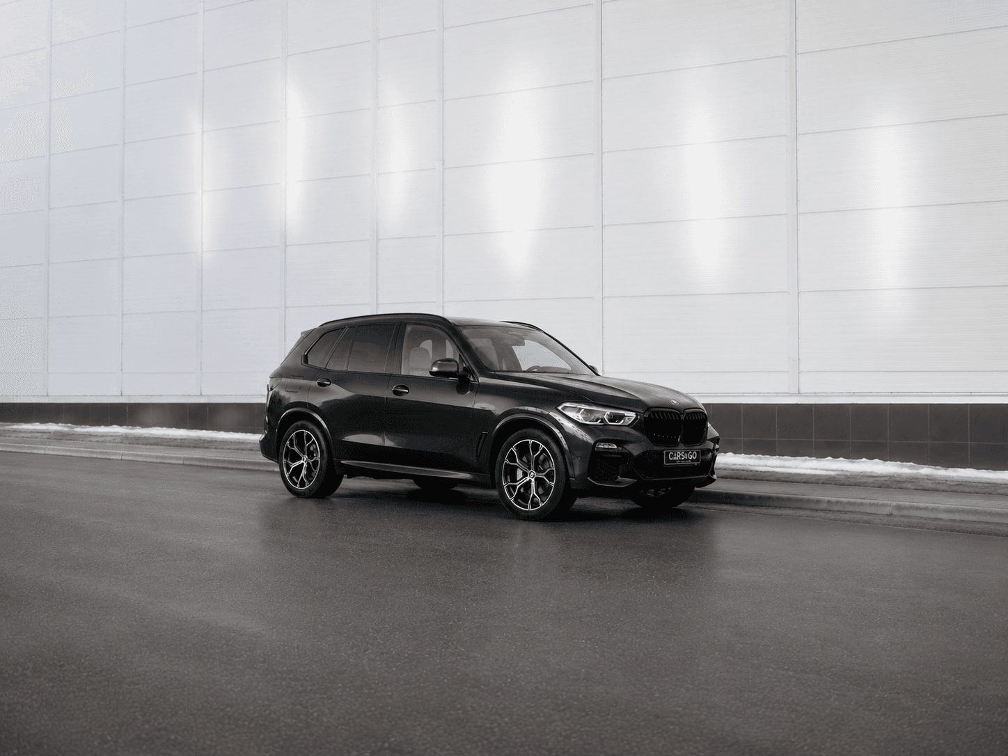 wide_exterior_automotive_photo_a_dark_black_bmw_s